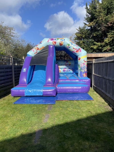 Party Castle Slide Combo, a bounce and slide combo for hire from Epic Inflatables & Soft Play Hire