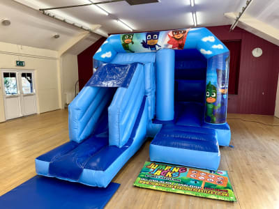 PJ Mask Blue Velcro With Slide, a inflatable slide for hire from Jumping Jacks Bouncy Castles