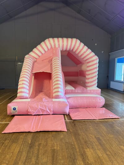 15 x 12ft Pink and White Candy Cane Combo Bounce and Slide, a bounce and slide combo for hire from Bounce House Inflatables