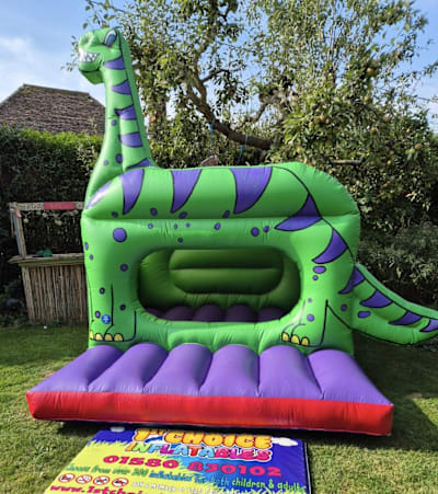 Bouncy Castle Dinosaur themed (Green) 10ft x 8ft, a bouncy castle for hire from 1st Choice Inflatables