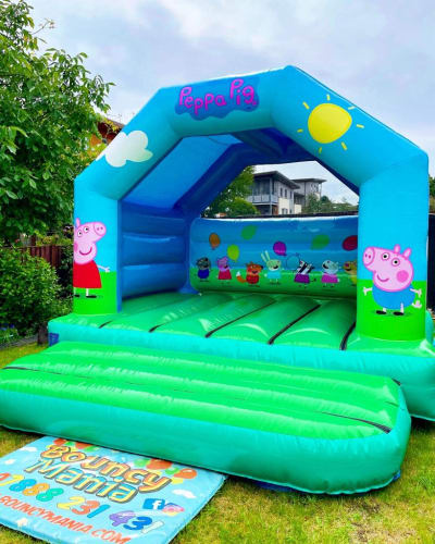 Peppa Pig Castle, a bouncy castle for hire from Bouncy Mania