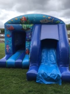 Little Mermaid Castle with Slide, a bounce and slide combo for hire from Happy Days Bouncy Castles