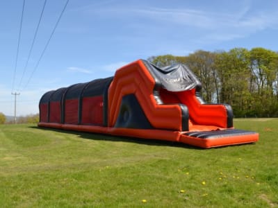 80ft Adult Xtreme Challenge Inflatable Assault Course, a assault course for hire from Animal Bouncers