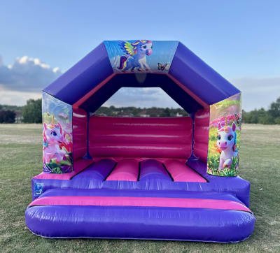 The Unicorn Kingdom 12x12ft, a bouncy castle for hire from The Bounce Boutique