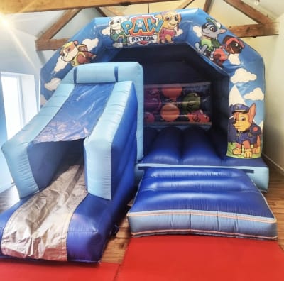 18ft x 12ft Paw Patrol Bouncy Castle Front Slide, a bounce and slide combo for hire from Bouncy Castle Factory