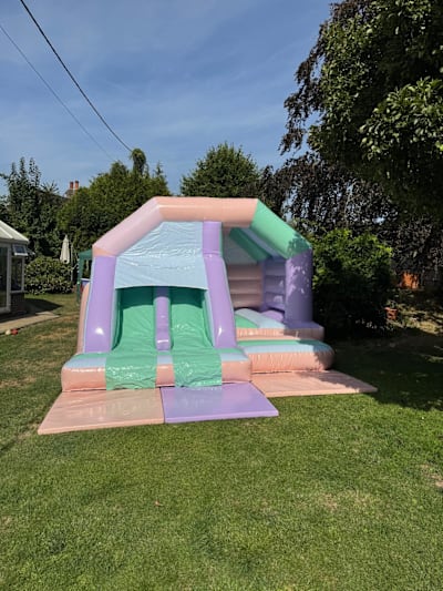 15x15ft Pastel Multicoloured Twin Front Slide Combi, a bounce and slide combo for hire from Bouncing Happy