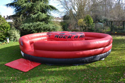 Rock n' Roll Gladiator, a inflatable game for hire from Alpha Bouncy Castles & Events