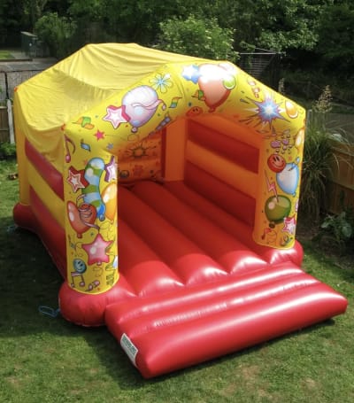 14 X 19 Carnival Themed Bouncy Castle, a bouncy castle for hire from Wazoggies Bounce House