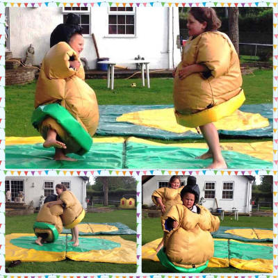 Sumo Wrestling Kids Suits, a inflatable game for hire from BJ's Bouncy Castles & Soft Play Hire