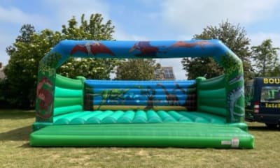 Adult Bouncy Castle Dinosaur theme 26ft x 26ft THE MASSIVE ONE!, a adult bouncy castle for hire from 1st Choice Inflatables