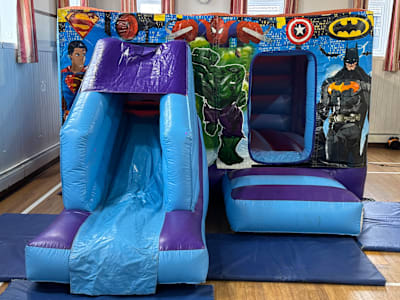 Superheros theme (Low height Combi slide Castle ), a bounce and slide combo for hire from Bounce N Fun