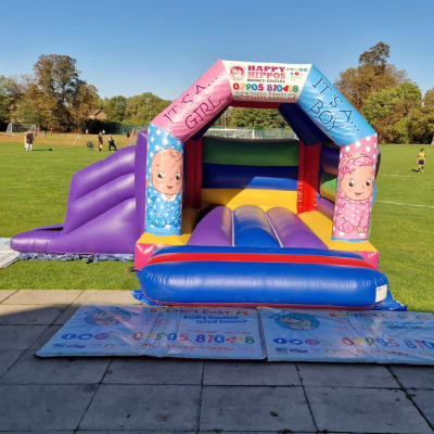 Gender Reveal Slide 15ft x 18ft - Purple & Red, a inflatable slide for hire from Happy Hippos Bouncy Castles