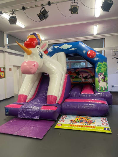 Unicorn Bounce N Slide, a bounce and slide combo for hire from Jump N Joy Inflatables