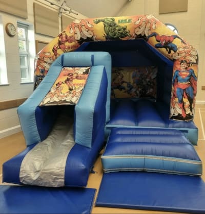 18ft x 12ft Marvel Bouncy Castle Front Slide, a bounce and slide combo for hire from Bouncy Castle Factory