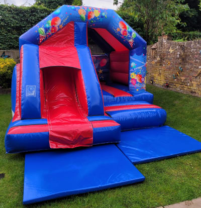 Bouncy Castle With Front Slide: Blue And Red, a bounce and slide combo for hire from Sploj