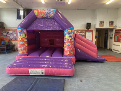 13x16 Happy Birthday Gloss Pink And Purple Slide Bouncy Castle, a bounce and slide combo for hire from Wallington Bouncy Castles