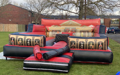 Gladiator Duel, a inflatable game for hire from Wizard Bouncy Castles