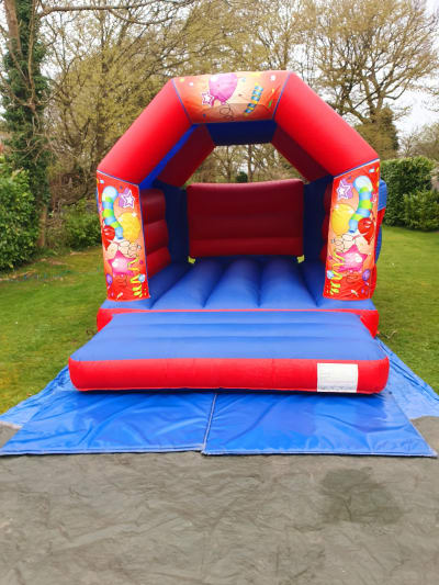 BALLOONS RED BOUNCY CASTLE 15FT vs 11ft, a bouncy castle for hire from All Bounce Surrey