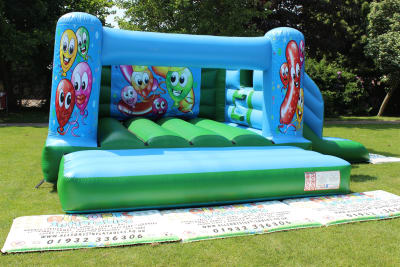 Happy Balloons Castle/Slide Combo, a bounce and slide combo for hire from Allsorts Inflatables