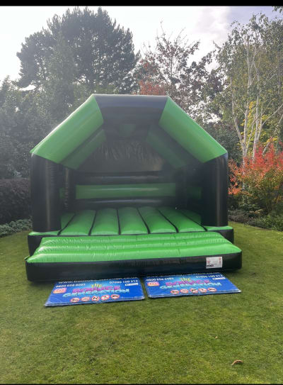 Glossy Black & Green Bouncy Castle (15x15ft Adult & Child), a adult bouncy castle for hire from The Bounce Generation