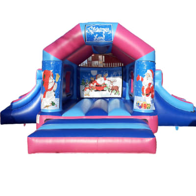 Christmas Bouncer Double Slide, a bounce and slide combo for hire from Jumping Jacks