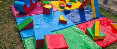 Multicoloured soft play + double rocker, a soft play set for hire from Bouncy Boss