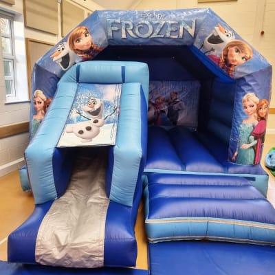 18ft x 12ft Frozen Bouncy Castle With A Front Slide, a bounce and slide combo for hire from Bouncy Castle Factory