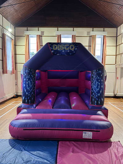 Disco Theme (Pink & Purple Castle), a bouncy castle for hire from Bounce N Fun