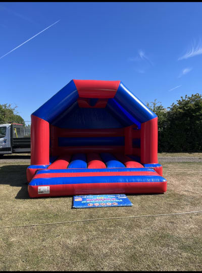 Gloss Red & Blue Bouncy Castle (15x15ft Adult & Child), a adult bouncy castle for hire from The Bounce Generation