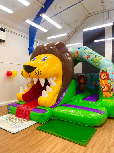 King Of The Jungle Bounce N Slide, a bounce and slide combo for hire from Bouncy Mania