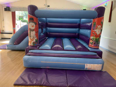 17ft x 15ft Christmas combi, a bouncy castle for hire from Bounce Mania
