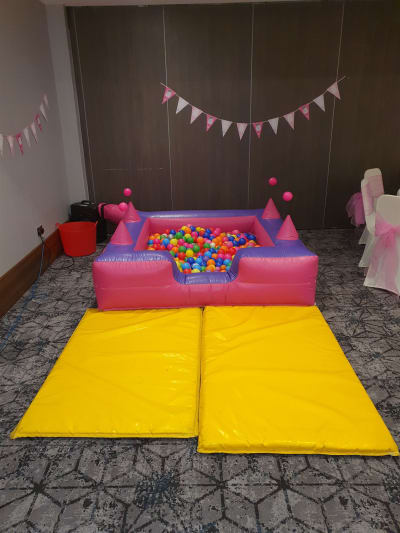 Pink / Purple Air Juggler Ball Pit, a soft play set for hire from All Bounce Surrey