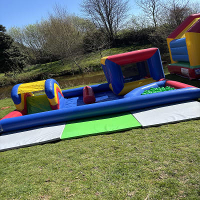Multicoloured Mini Playzone, a toddler inflatable for hire from Bouncing Happy