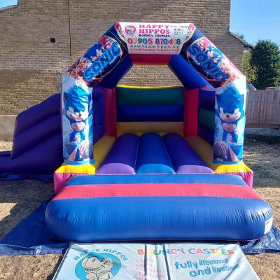 Sonic Slide 15ft x 18ft - Purple & Red, a inflatable slide for hire from Happy Hippos Bouncy Castles