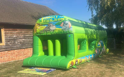 Assault Course Jungle Fun Run themed inflatable 25ft x 10ft, a assault course for hire from 1st Choice Inflatables