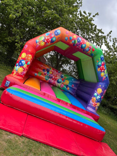 15x15ft Multicoloured Party A Frame Bouncer, a bouncy castle for hire from Bouncing Happy