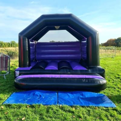 Purple and Black Party Castle (Child), a bouncy castle for hire from Crockerz Castles