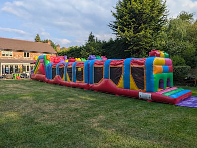 Lego 3D 3-Part Fun Run (65ft), a assault course for hire from Elmbridge Inflatables