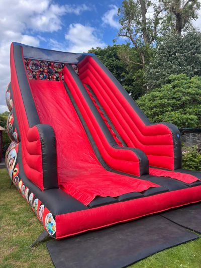 14ft Platform Adult Slide, a inflatable slide for hire from Animal Bouncers