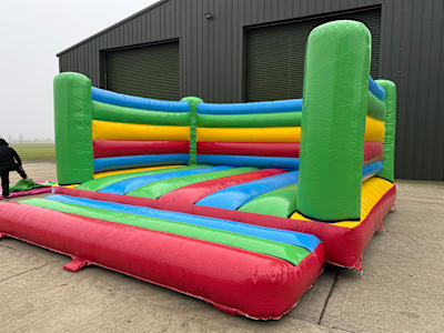 6m x 6m Adult Rainbow Castle, a adult bouncy castle for hire from Sploj