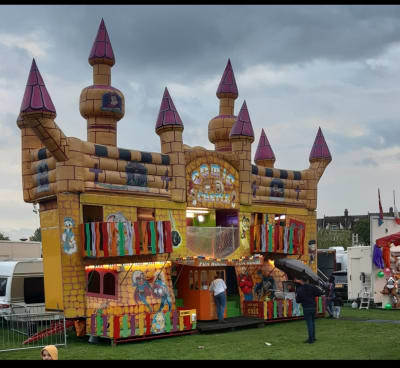 Funhouse Cottage, a bouncy castle for hire from Animal Bouncers