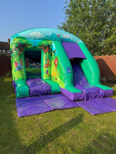 Jungle Bounce n Slide (12ft x 18ft), a bounce and slide combo for hire from Elmbridge Inflatables