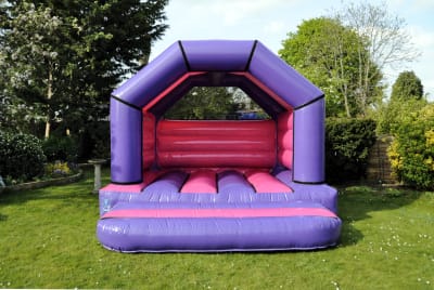 Purple and Fuchsia Bouncy Castle 12ft x 12ft A Frame, a bouncy castle for hire from Bouncy Boss