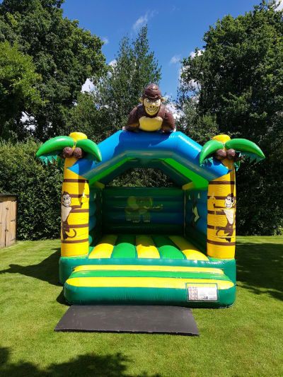 13ft x 17ft Monkey Trouble, a bouncy castle for hire from Rick's Castles