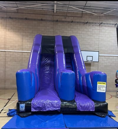 10ft Purple and Black Rush Slide, a inflatable slide for hire from Crockerz Castles
