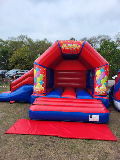 Party Time Side Slide Combo, a bounce and slide combo for hire from Kendall's Castles