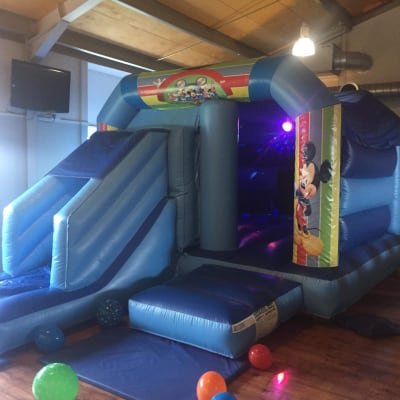 Mickey Mouse Combo, a bouncy castle for hire from Bounce About Sussex
