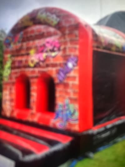 Graffiti Assault Course, a assault course for hire from Happy Days Bouncy Castles