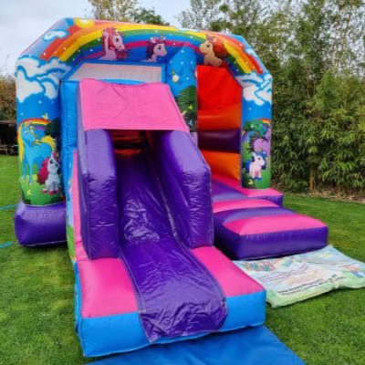 Unicorn slide castle, a bounce and slide combo for hire from Bounce About Sussex