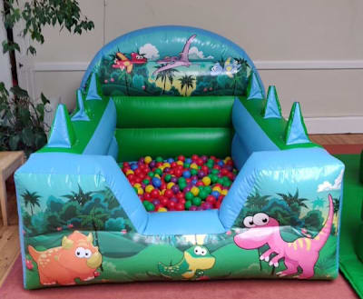 Dino Air Juggler Ball Pond, a soft play set for hire from Happy Days Bouncy Castles